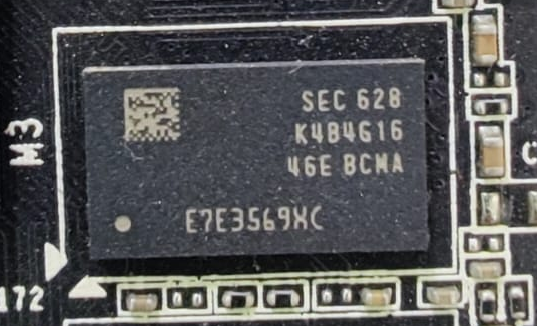 Close-up photograph of a packaged DRAM chip on a circuit board; product category reference, not a live-stock listing